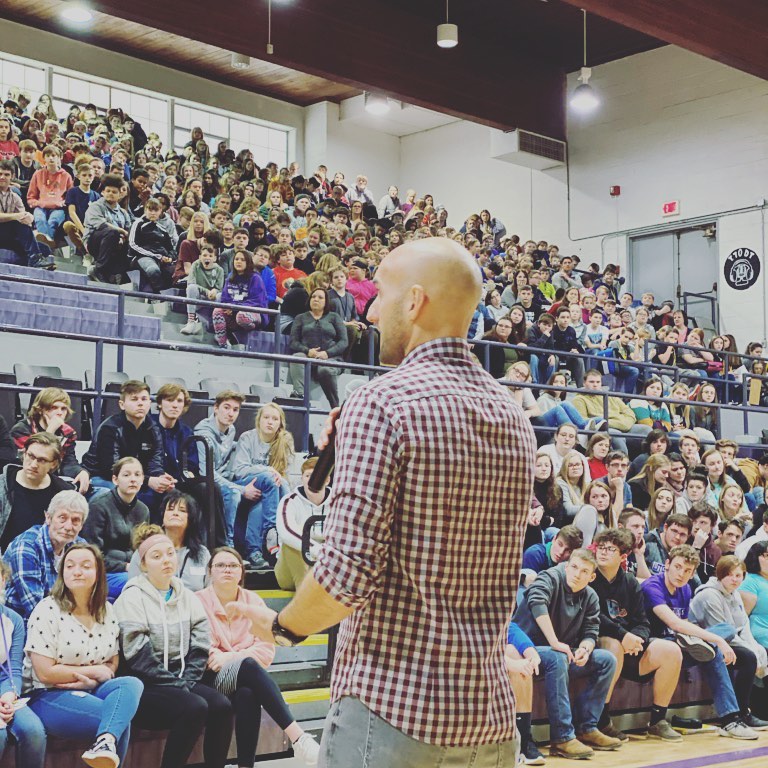inspirational speaker presents to high school assembly
