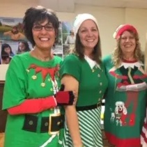 volunteers dressed as holiday elves